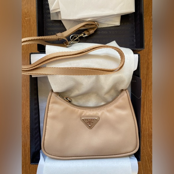Prada Handbags - Prada re edition nylon extra mini shoulder handbag with chain and strap . Rare